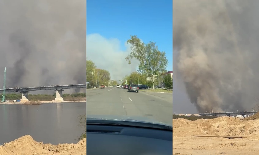 огромный столб дыма поднимается за мостом через зею в районе владимировки
